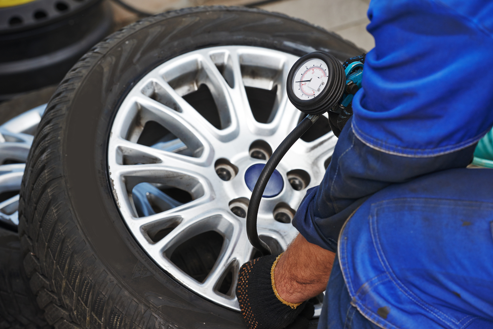 Mechanic performing tire maintenance